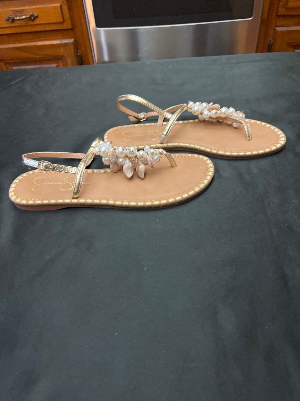 Brand New Jessica Simpson Gold Leather Sandals With Pearl /Sea Shell Trim. 8.5.